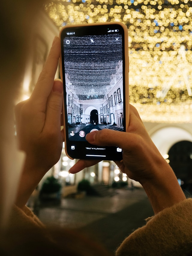 taking a photo of holiday lights
