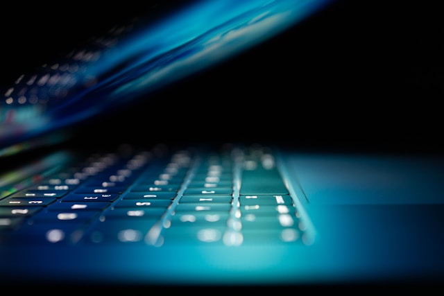Laptop lit up, half closed