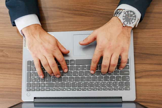 hands on a computer keyboard